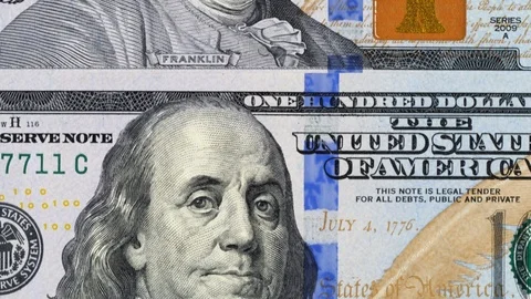 US 100 dollar bills close up tracking. Slider shot, top view. 4K Stock Footage 125565161