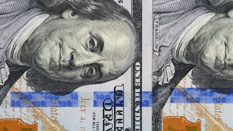 US 100 dollar bills close up tracking. Slider shot, top view. 4K Stock Footage 125566027