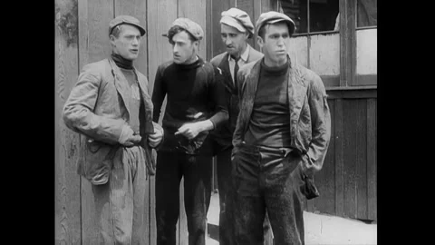 US - 1914 - in this silent comedy, a man tries to convince his strong, burly pal Stock Footage 337953219
