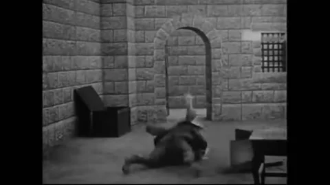 US - 1914 - in this silent comedy, Patchwork Girl and others run over a gate's Video stock 288080960