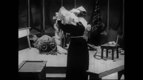 US - 1914 - in this silent fantasy, a witch places some items on a table, then Stock Footage 288084603