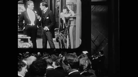 US - 1915, in this silent comedy, the audience in a movie theatre talks and Stock Footage 284719714