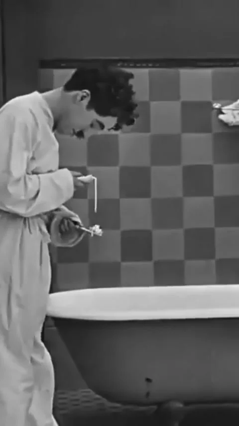 US - 1915, in this silent comedy, a drunk puts toothpaste on his toothbursh and Stock Footage 339131656