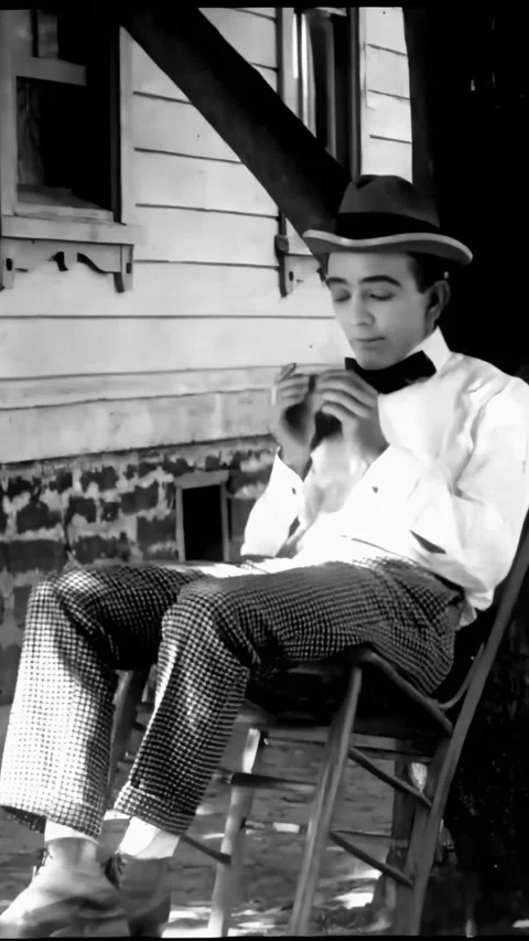 US - 1916 - in this silent comedy, a man pretends to be unwell to avoid working. Stock Footage 340194774