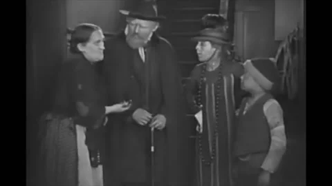 US - 1919 - in this silent comedy, some neighbors are talking at the bottom of a Stock Footage 254195784
