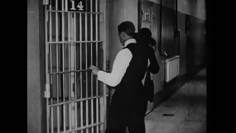 US - 1920 - in this silent drama, a man escapes from jail in his brother's Stock Footage 301523008