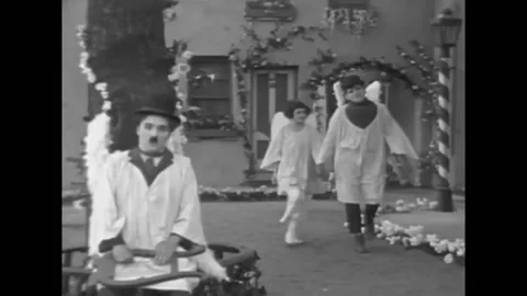 US - 1921 - in this silent comedy, in a dream, a man and his neighbors are all Stock Footage 301522981