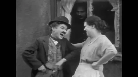 US - 1921 - in this silent comedy, a man tries to strangle another man when he Stock Footage 301527216