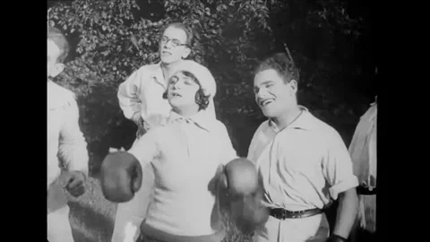 US - 1923 - in this silent comedy, a man calls his daughter, who is boxing with Stock Footage 341992497
