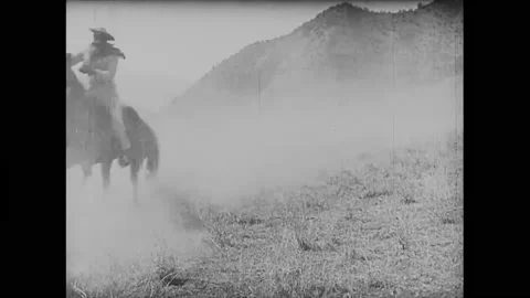 US - 1924 - in this silent western, two fighting men get dangerously close to a Stock Footage 288010272