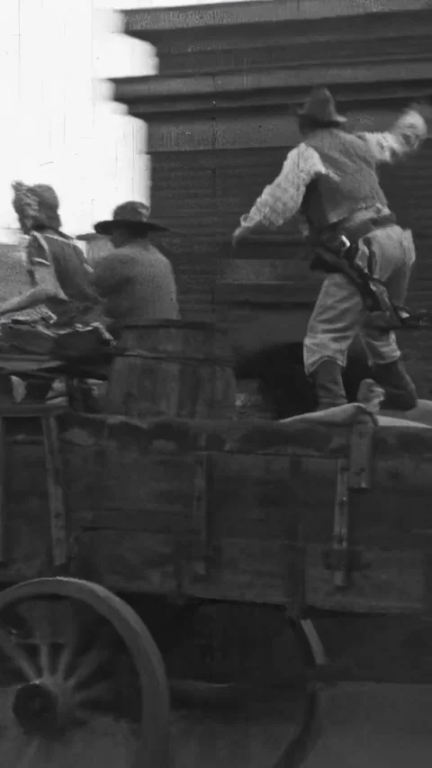 US - 1925 - in this silent comedy, an agitated man gets off his cart when he Stock Footage 340329958