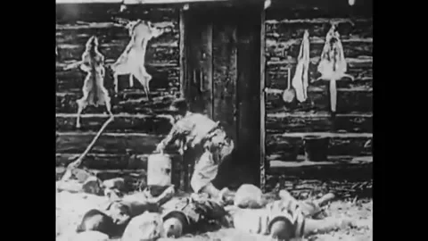 US - 1925 - in this silent comedy, a criminal grabs a canister of gasoline and Stock Footage 259378647