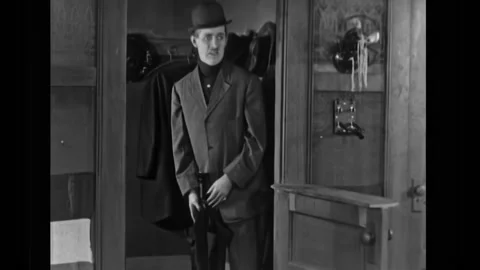 US - 1925 - in this silent comedy, a man at a club confronts a group of angry Stock Footage 325217379