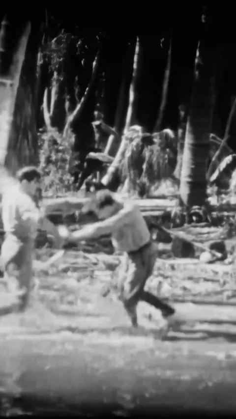 US - 1925 - in this silent comedy, a woman laughs when two men fight in the Stock Footage 340195170