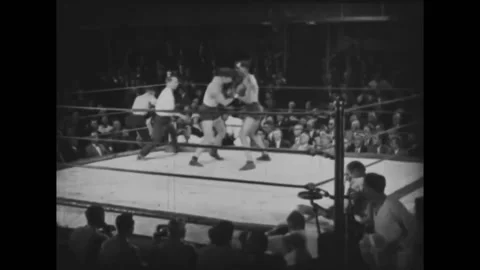 US - 1925 - in this silent drama, during a boxing match, a boy cheers on his Stock Footage 277297402