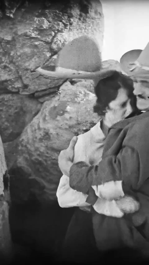 US - 1925 - in this silent western, an outlaw forces a woman to abandon an Stock Footage 340295567