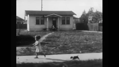 US - 1926 - in this silent comedy, a man who is scared of dogs runs from a dog Stock Footage 327735363