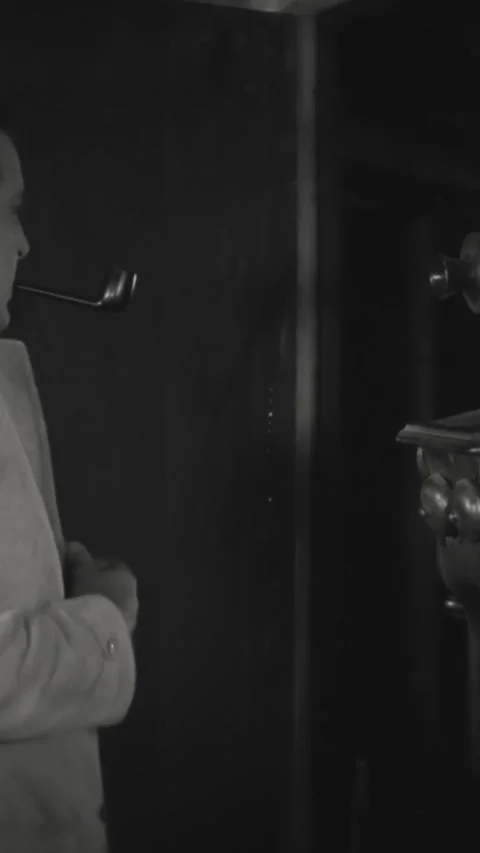 US - 1926, in this silent comedy, a man opens the door and calls out into the Stock Footage 339112162