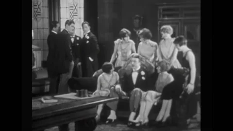 US - 1926 - in this silent comedy, a nobleman tells some flappers exaggerated Stock Footage 327739973