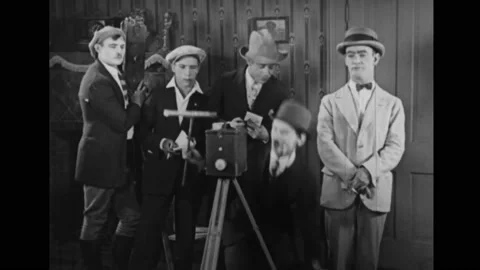 US - 1927 - in this silent comedy, a man poses for a photo. The photographer Stock Footage 277341231