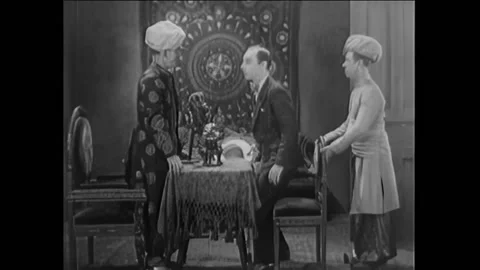 US - 1927 - in this silent comedy, a man seeks a clairvoyant's help to find a Stock Footage 316635774