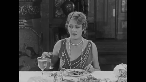 US - 1927 - in this silent comedy, a man without pants, who is hiding under the Stock Footage 323220065