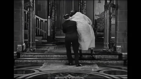 US - 1927 - in this silent comedy, two men try to get an unconscious woman out Stock Footage 296391468