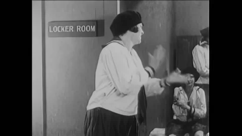 US - 1927 - in this silent comedy, two men, one missing his pants and the other Stock Footage 316636684