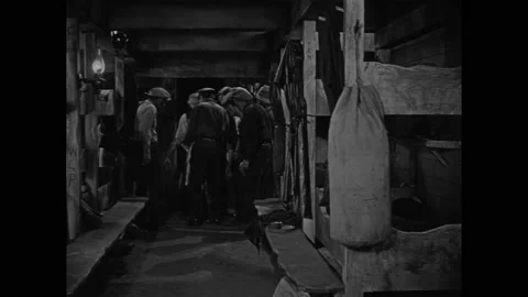 US - 1927 - in this silent drama, when two sailors carry a beaten, unconscious Video stock 327681405
