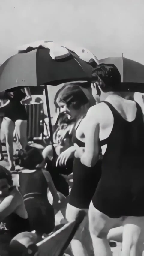 US - 1928 - in this romance, a couple at the beach has fun in the ocean, along Stock Footage 339512349