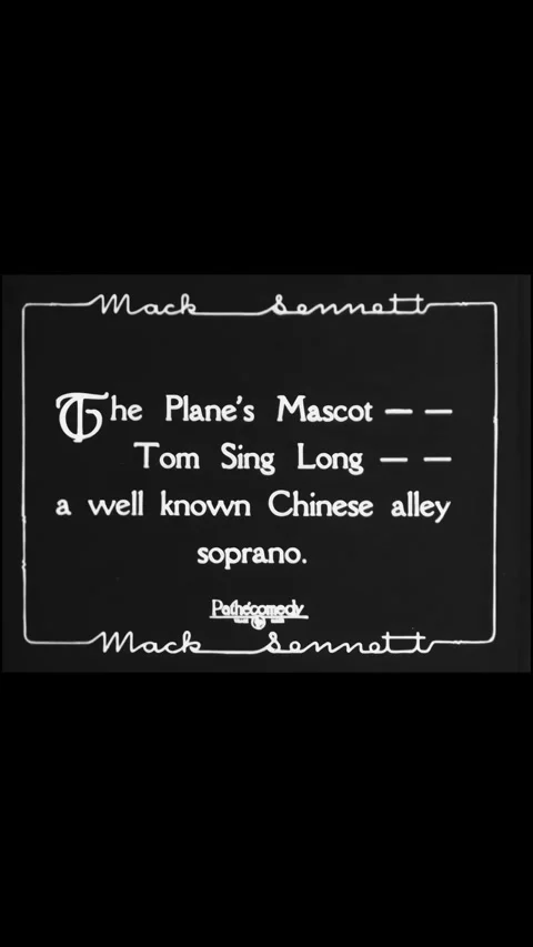 US - 1928 - in this silent comedy, a black cat drinks milk from a bottle, but Stock Footage 339780883