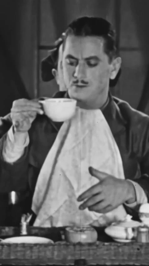 US - 1928 - in this silent comedy, the copilot brings a cup of coffee to the Stock Footage 339780894