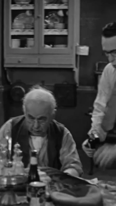 US - 1928 - in this silent comedy, to distract a begging dog at a fair, a man Stock Footage 339498894