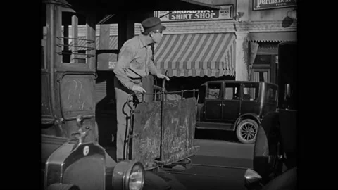 US - 1928 - in this silent comedy, a driver on a horse-pulled tram tells vendors Stock Footage 288011294