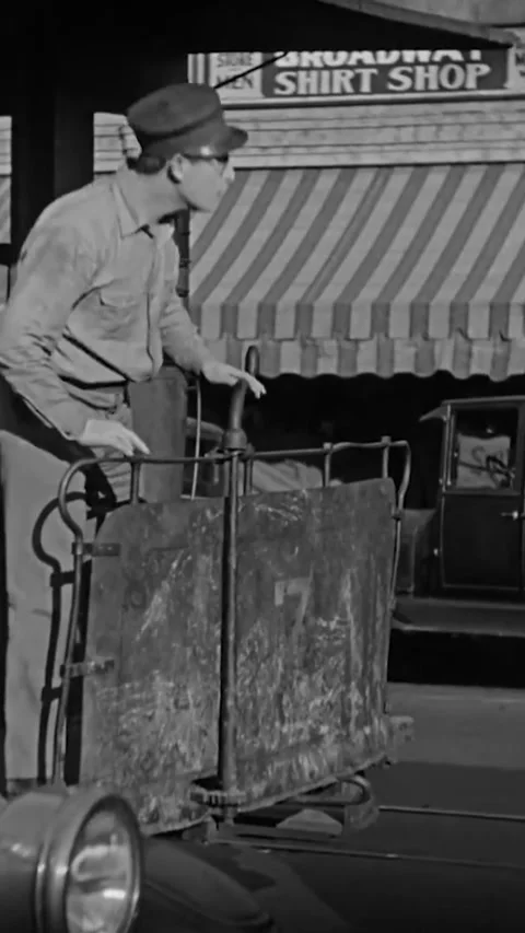 US - 1928 - in this silent comedy, a driver on a horse-pulled tram tells vendors Stock Footage 339499701