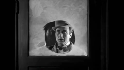US - 1928 - in this silent comedy, a man enters through the wrong door, offering Video stock 301525959
