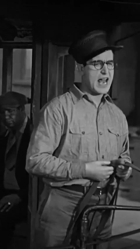 US - 1928 - in this silent comedy, a man uses a rope to bind a tram to a car. Stock Footage 339500465
