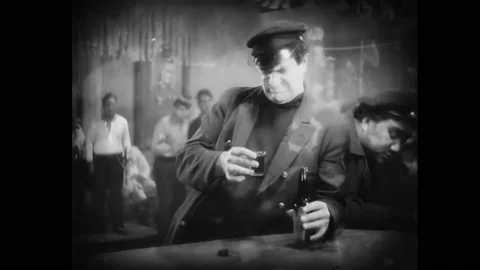 US - 1928 - in this silent drama, a drunk sees the face of the woman who Stock Footage 277347450