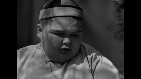 US - 1929 - in this comedy, a boy changes his mind about a job when he realizes Stock Footage 288081885