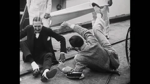 US - 1929 - in this comedy, a man climbs out of the water onto a pier and Stock Footage 313206615