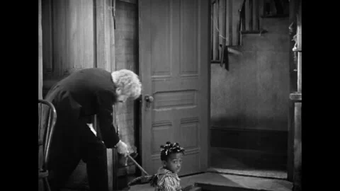 US - 1929 - in this comedy, a man pulls a boy out of a basement while his Stock Footage 337972331