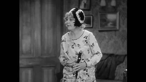 US - 1929 - in this drama, a dancer comes home, complaining about her work Stock Footage 341988121