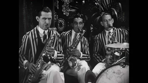 US - 1929 - in this romance, a couple is sitting on a porch swing while a music Stock Footage 301520278