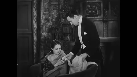 US - 1929 - in this romance, a man asks his girlfriend to forgive him for his Stock Footage 304351637