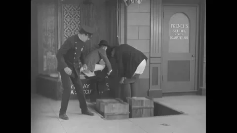 US - 1929 - in this silent comedy, a cop catches two men putting their pants on Stock Footage 308176760