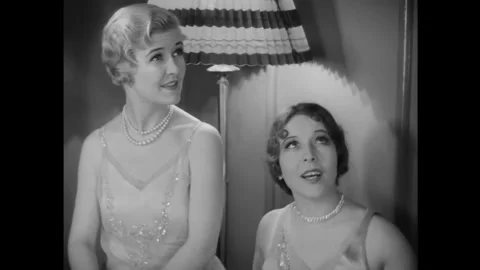 US - 1929 - in this silent comedy, a young woman burps when she speaks to an Stock Footage 337969267