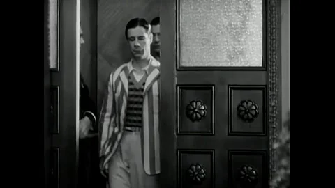 US - 1930 - in this comedy, doctors and nurses await a famous pilot, unaware Stock Footage 340582454