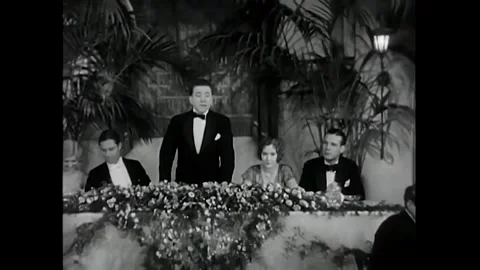 US - 1930 - in this comedy, a drunk banquet host introduces a famous pilot, Stock Footage 340582449