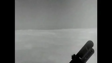 US - 1930 - in this comedy, during a plane race, a pilot flies his plane very Stock Footage 340582476