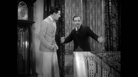 US - 1930 - in this comedy, a man helps up his father-in-law after a mishap at a Stock Footage 325209743
